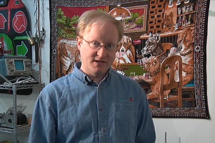 Ben Heck in front of Dogs Playing Poker Mural